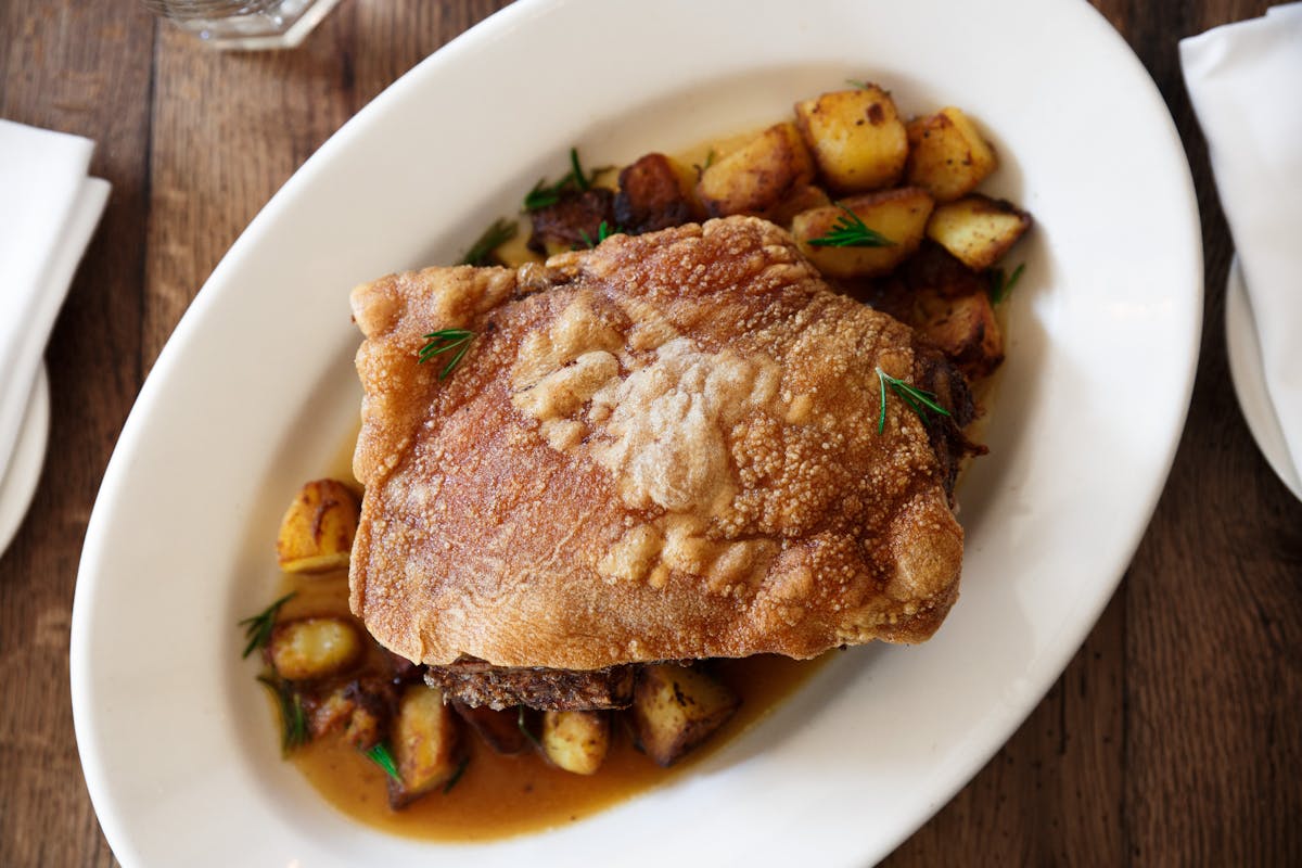 maialino al forno - our signature dish of roast pork and potatoes