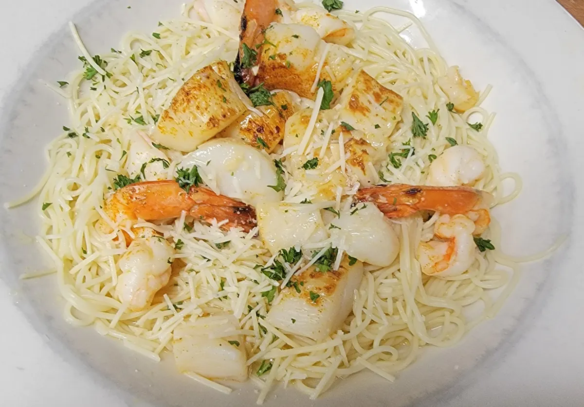 a pasta dish with broccoli on a plate