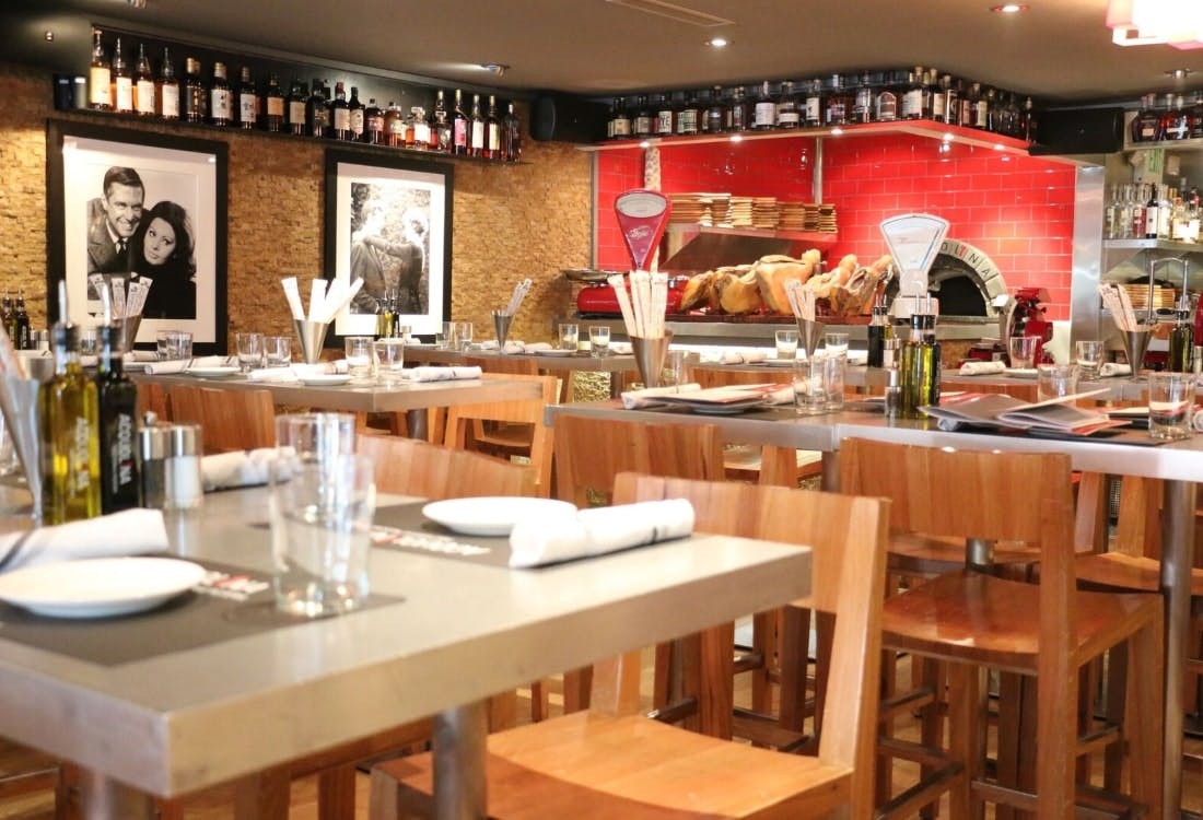 a kitchen with a dining table in a restaurant