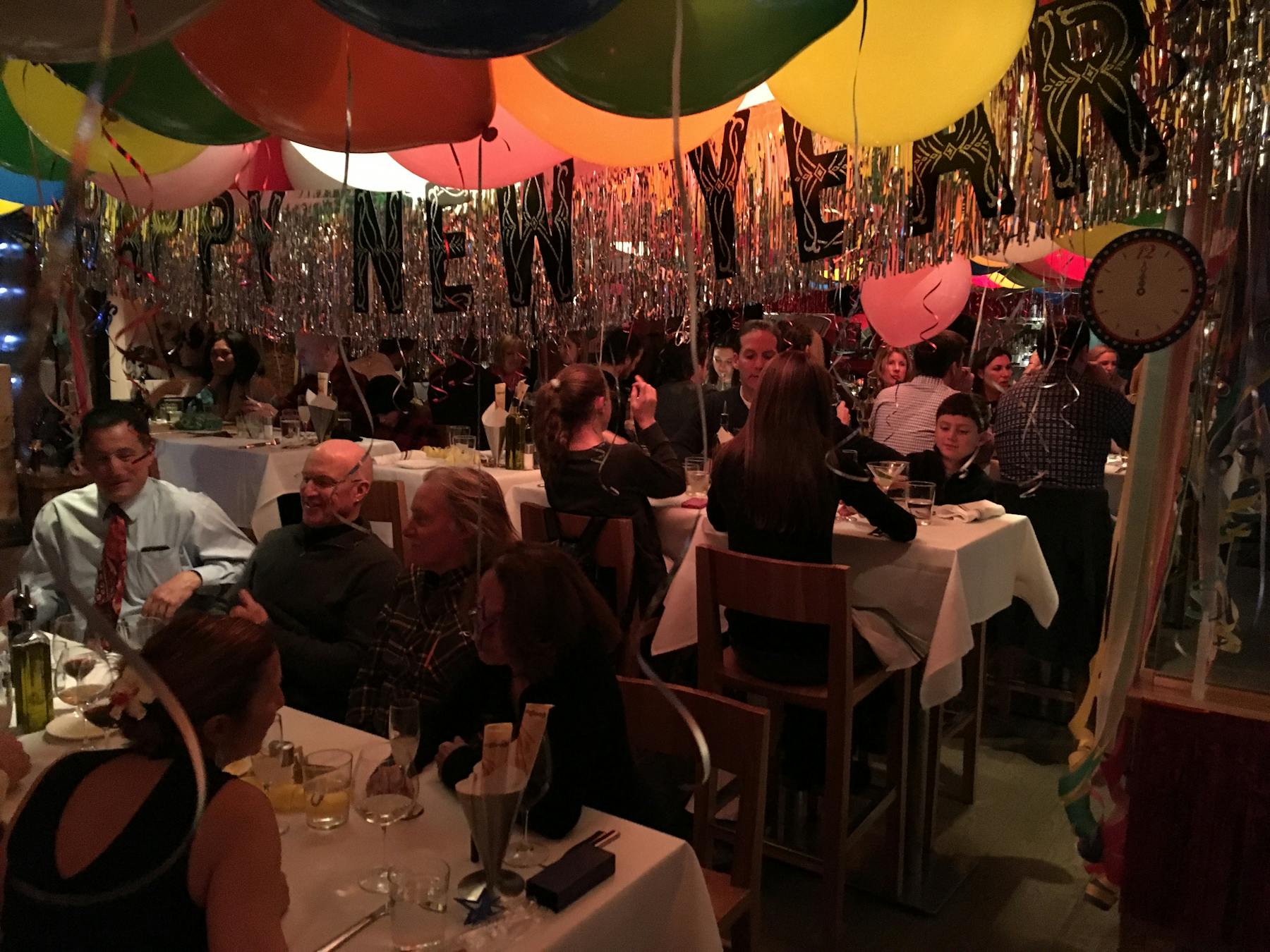 a group of people sitting at a table in front of a crowd