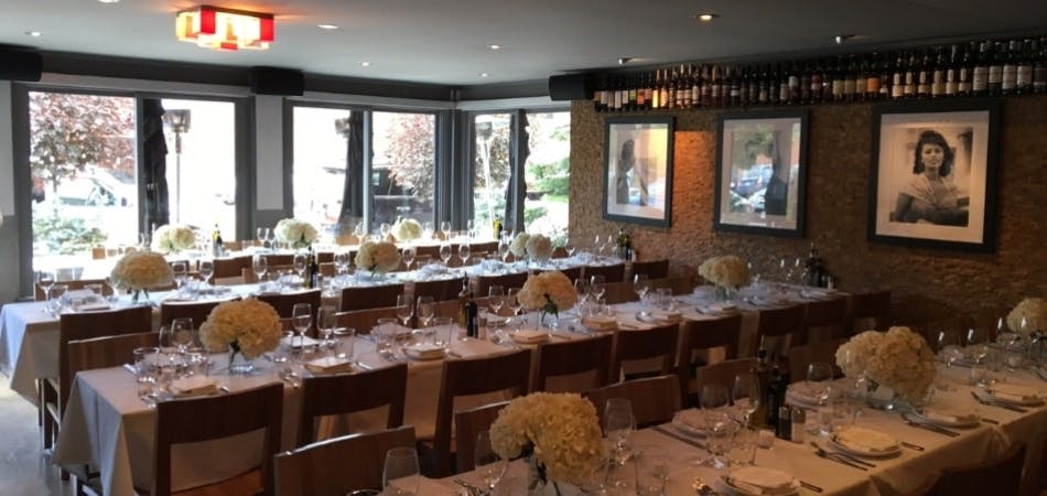 a dining room table in front of a window