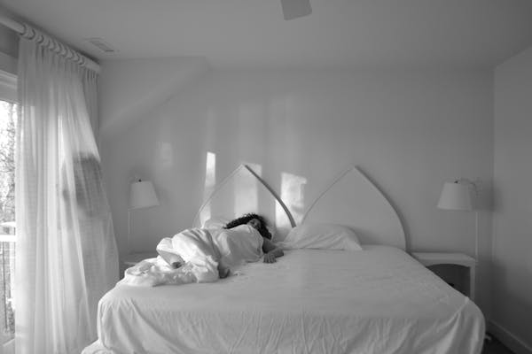 a bedroom with a bed in a hotel room