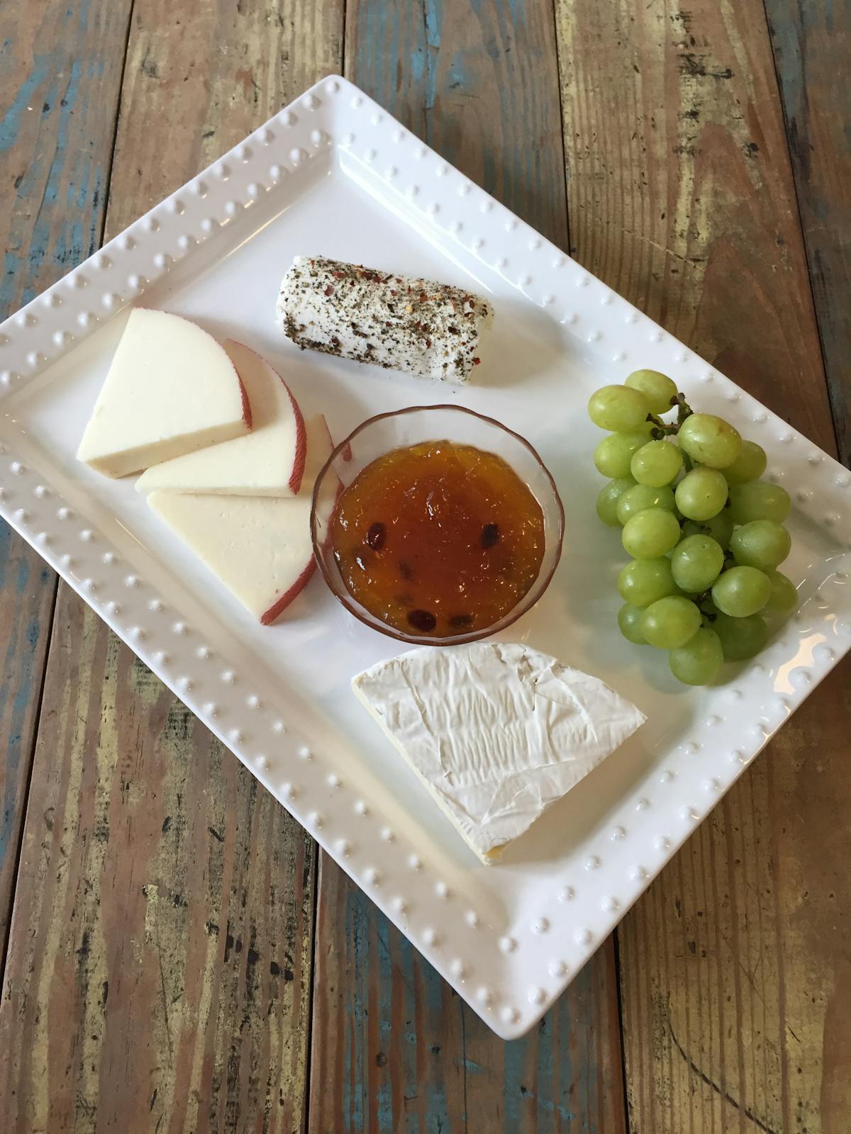 a plate of food on a wooden table