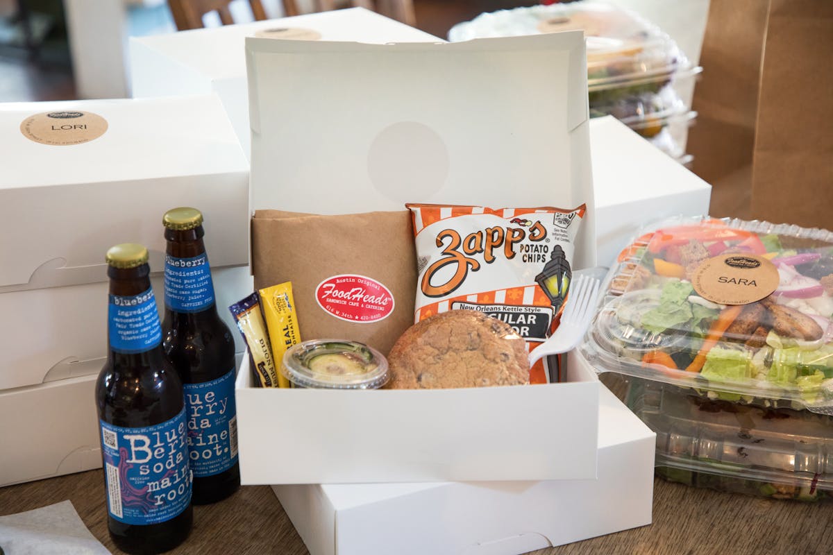 a box filled with different types of food on a table