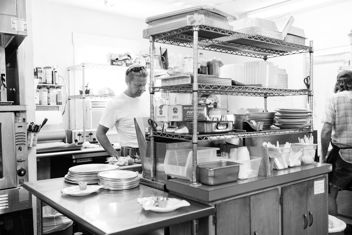 a man cooking in a kitchen