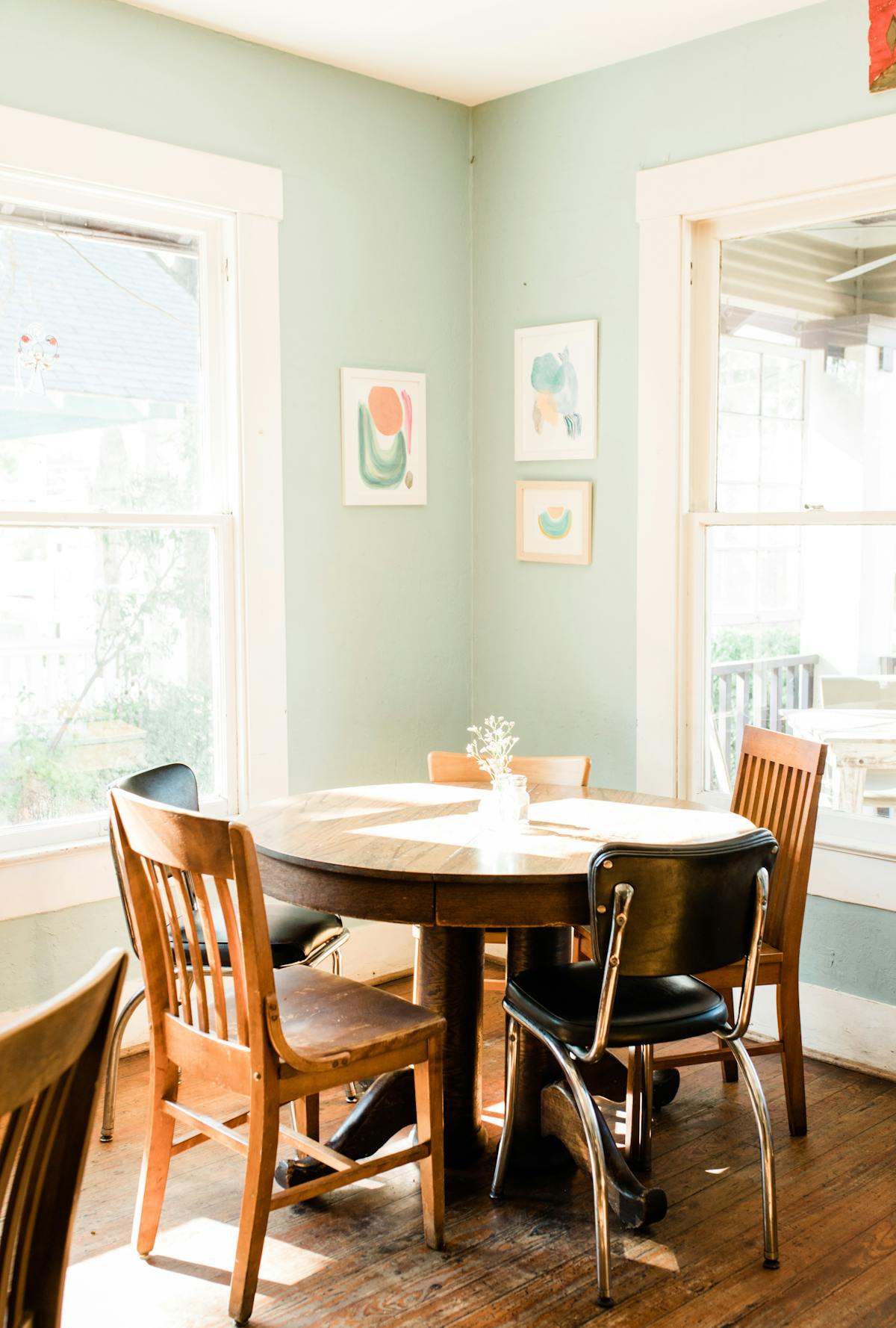 a dining room table in front of a window