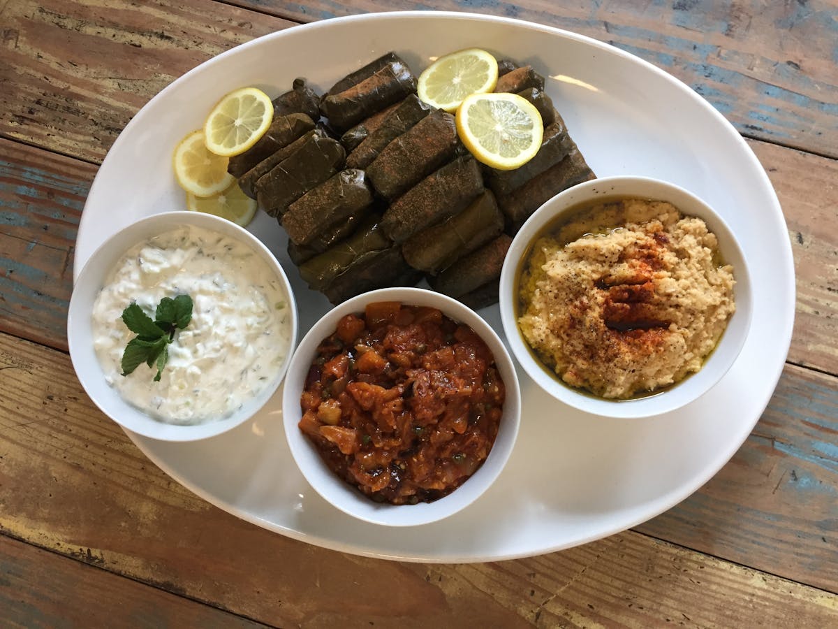 a bowl of food on a plate on a table