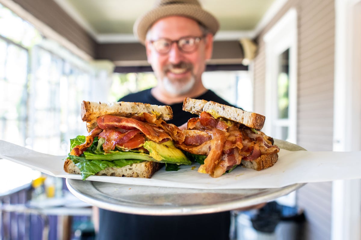 a plate of food with a sandwich and a salad