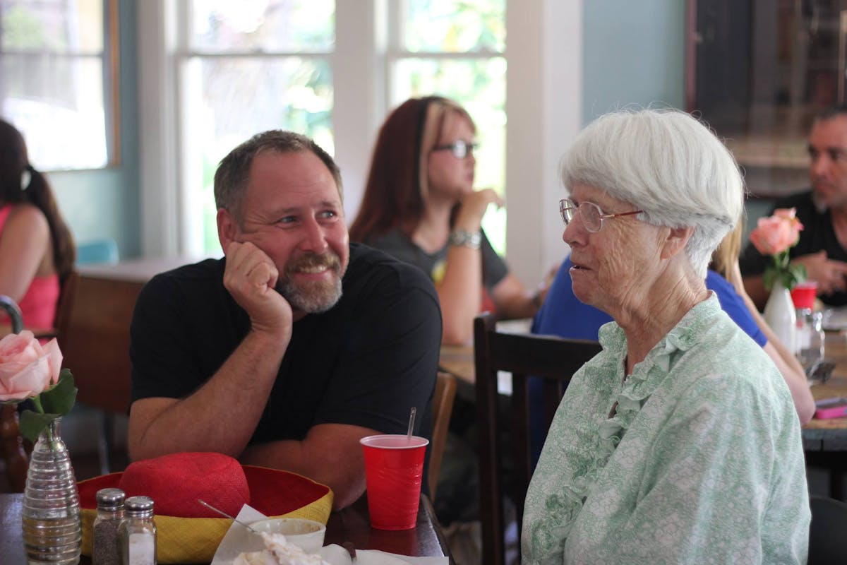 a group of people sitting at a table