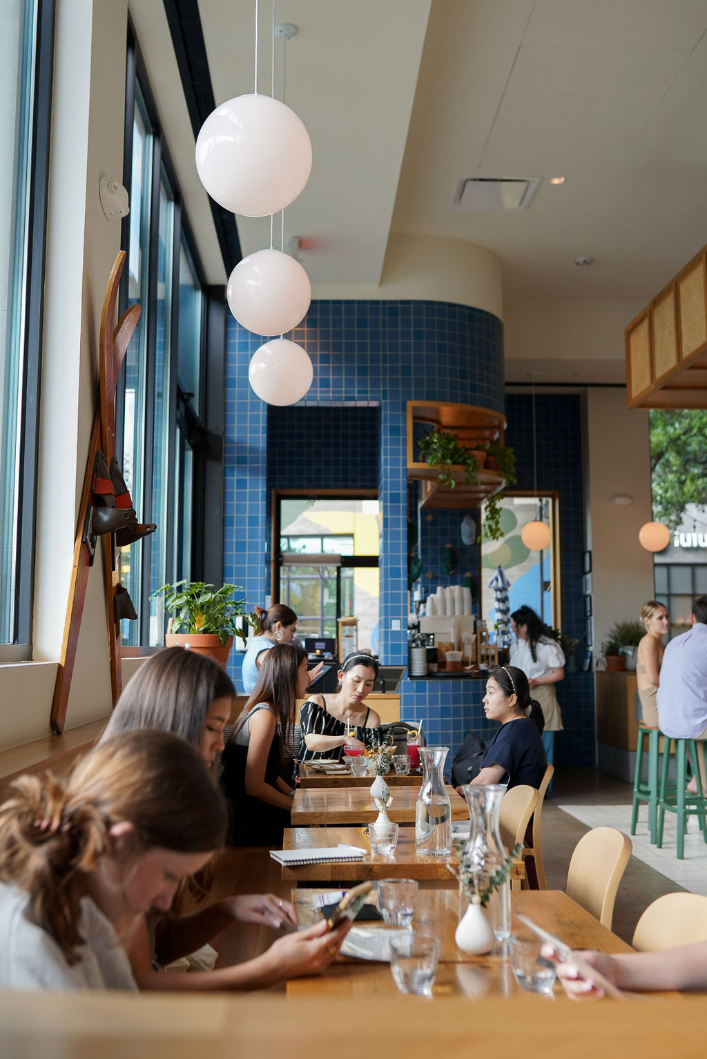 a group of people sitting at a table in a restaurant
