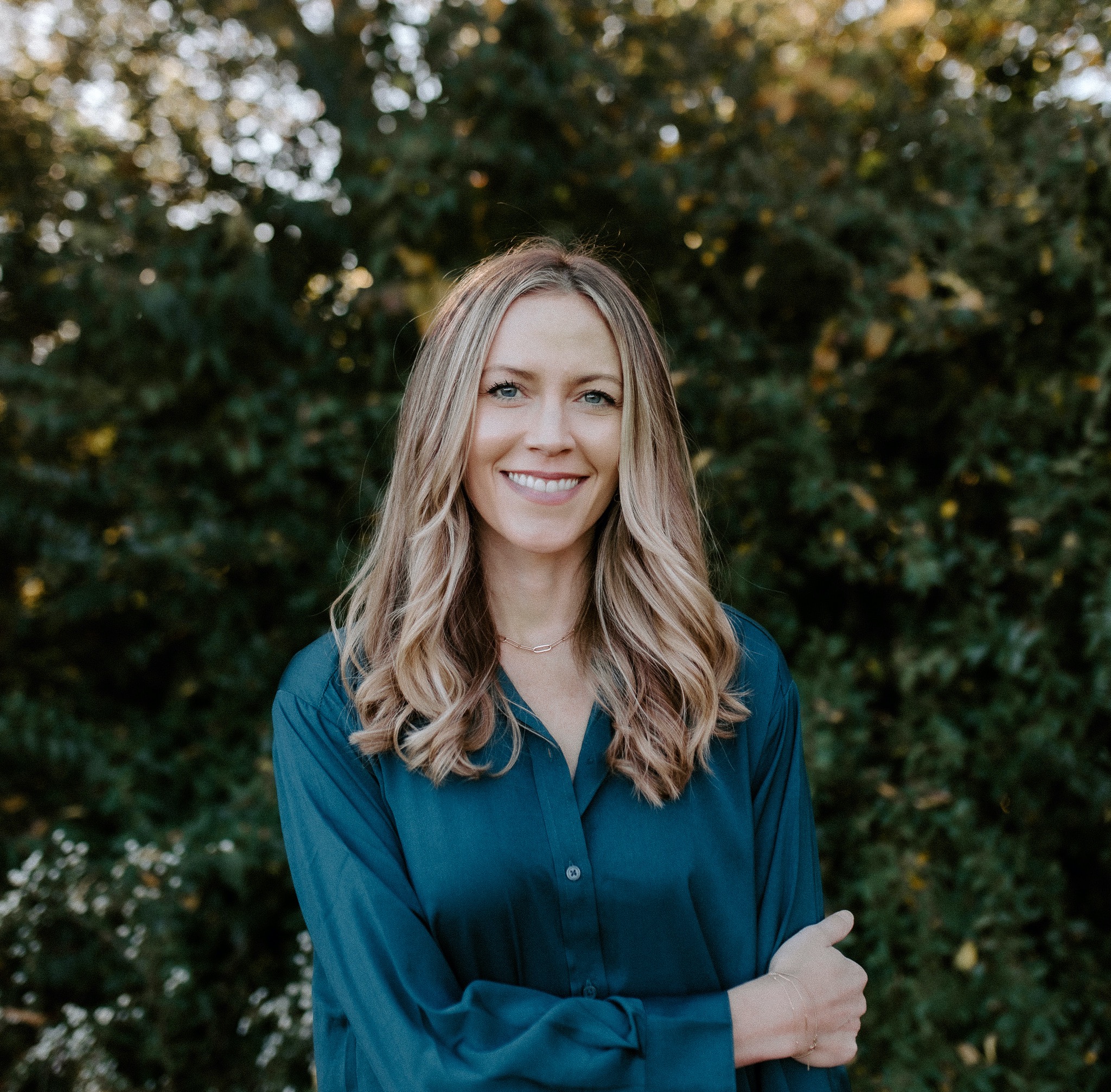 a person standing in front of a forest