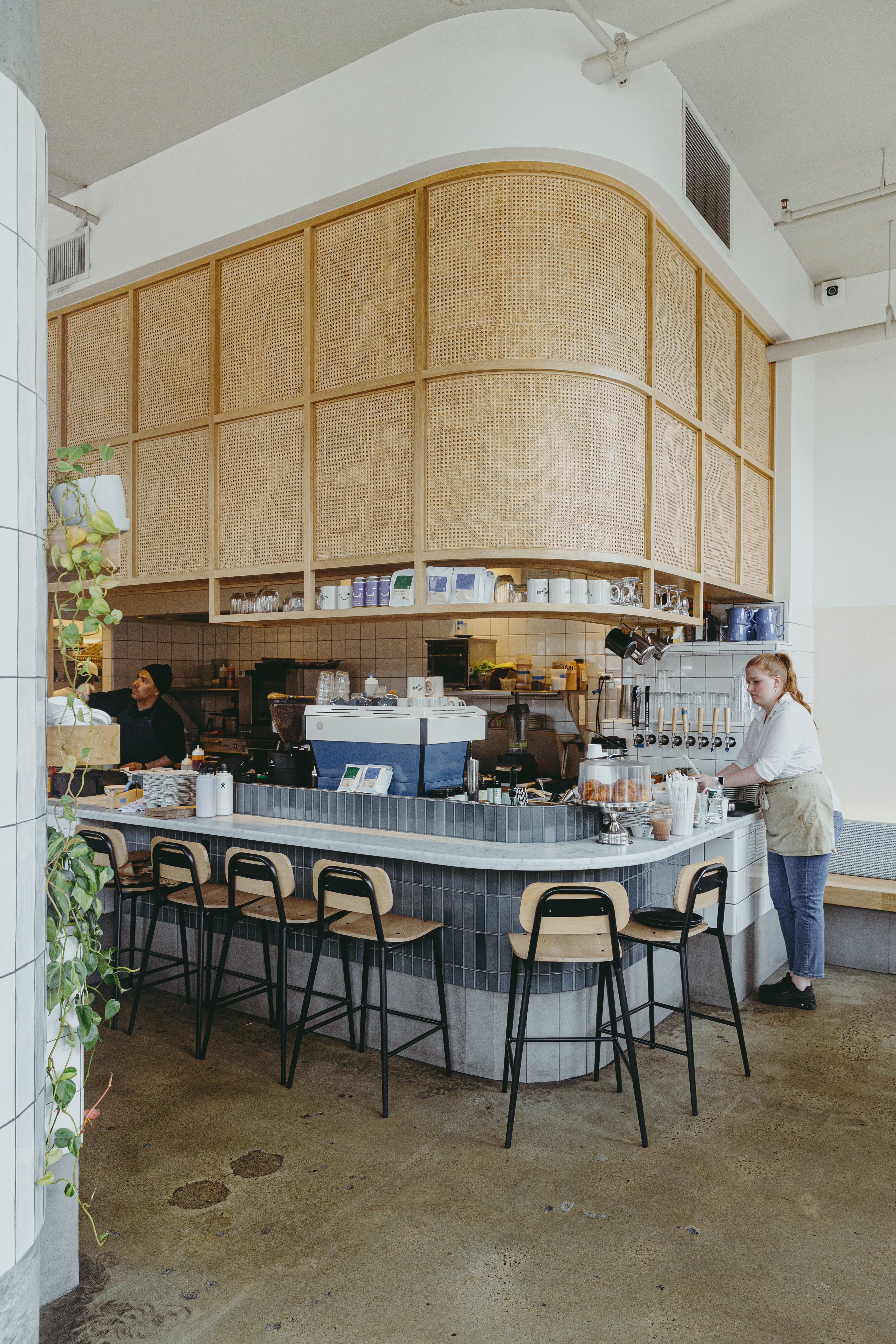 a person sitting in a chair in front of a building