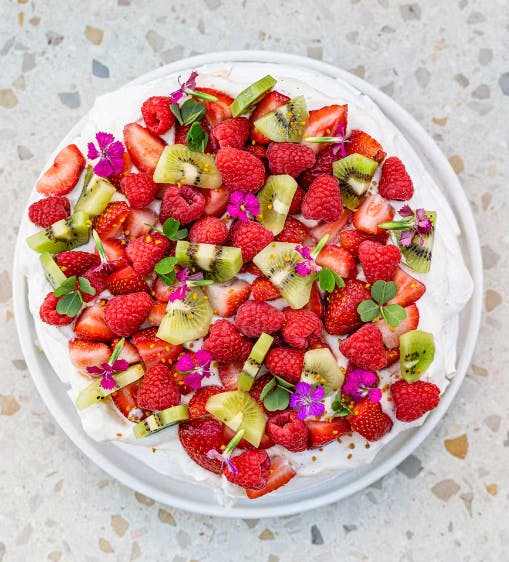 a bowl of fruit salad on a plate