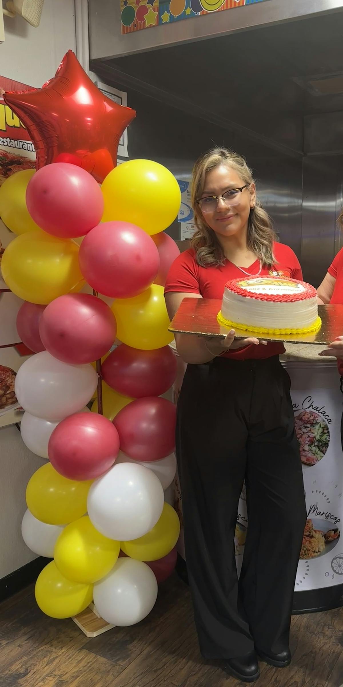 a person holding a cake