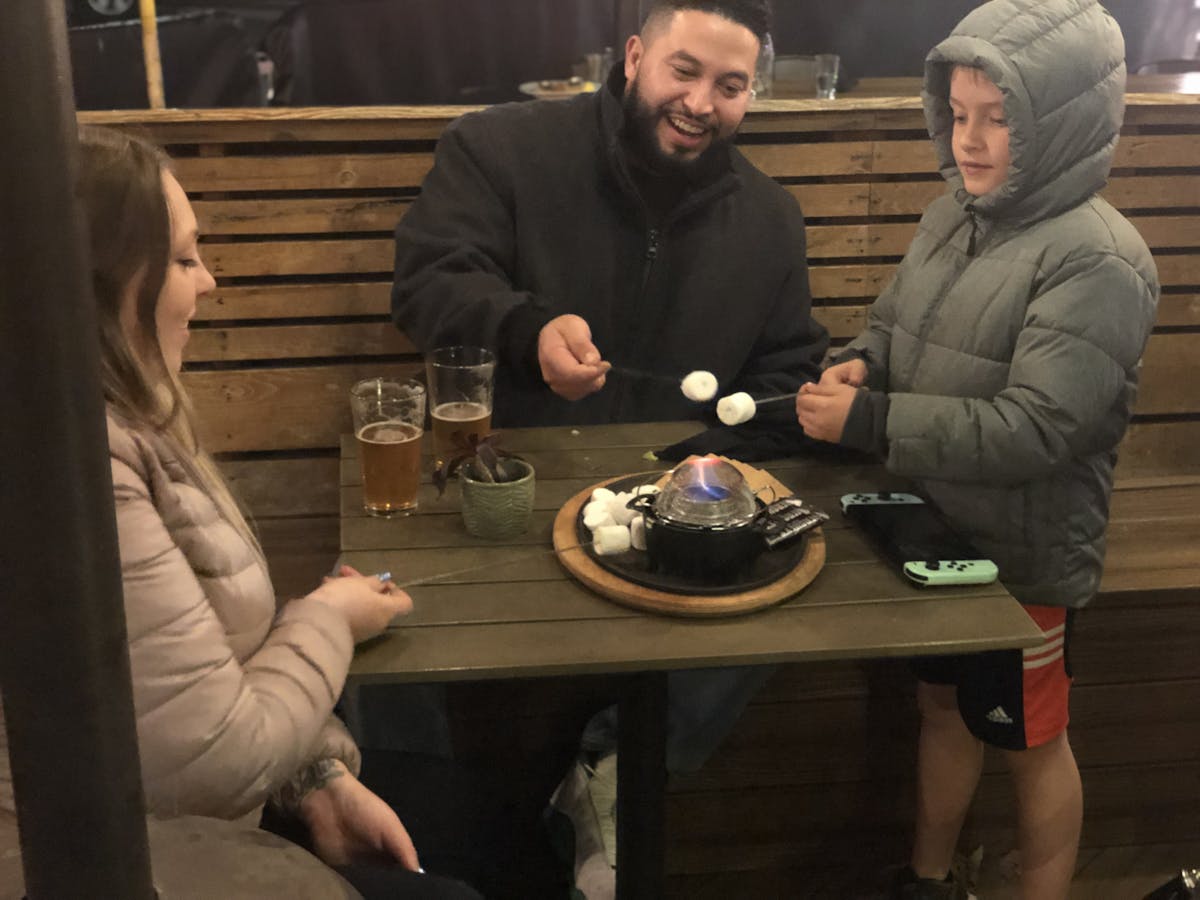 a group of people sitting at a table