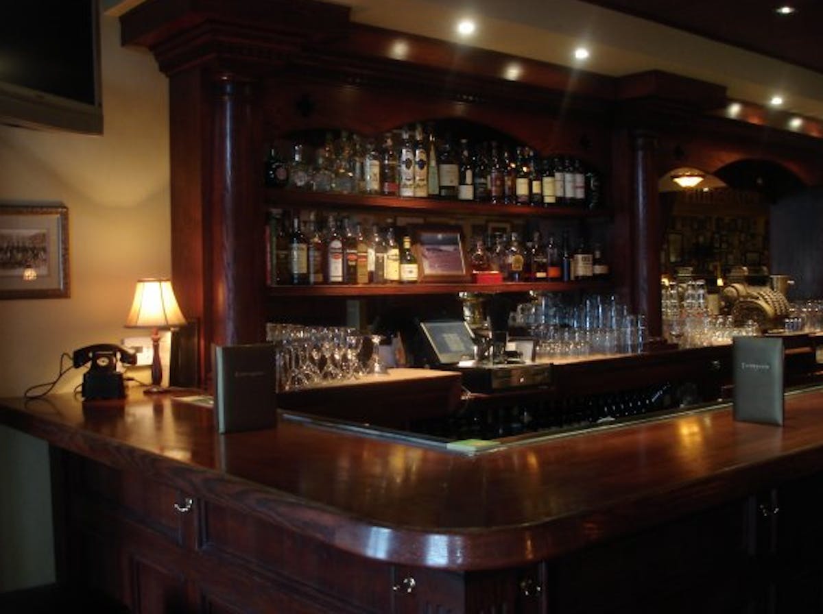 a kitchen with an island in the middle of a restaurant