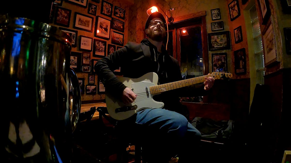 a man holding a guitar