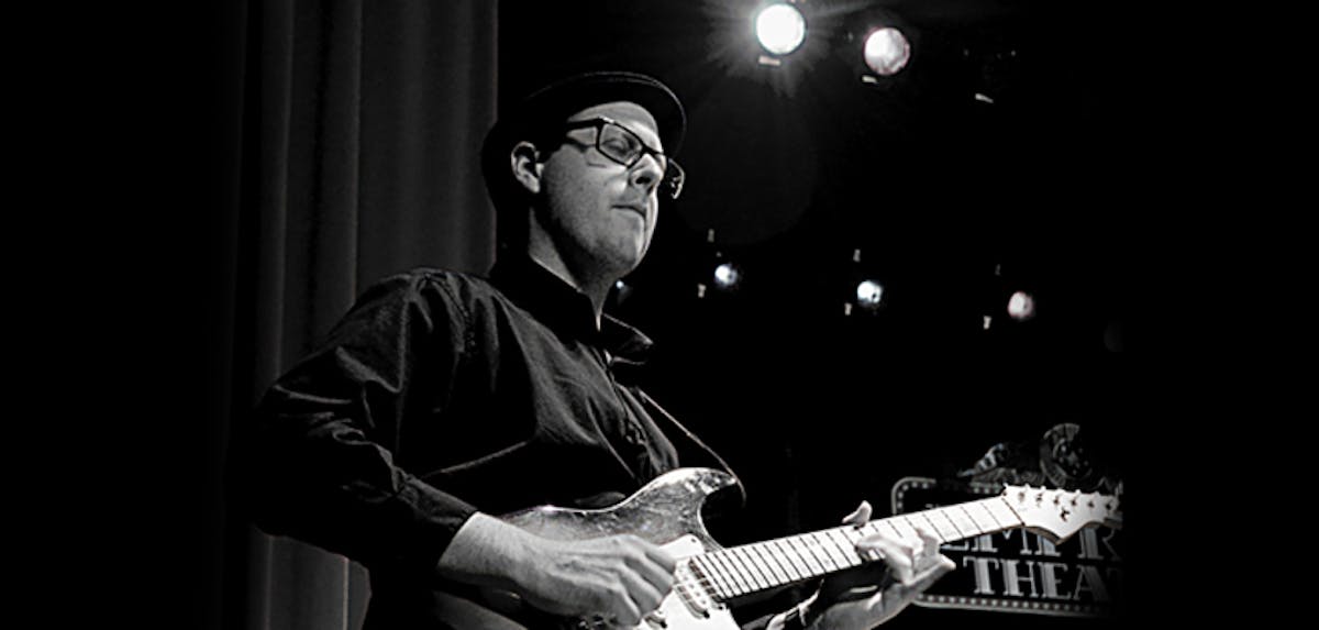 a man holding a guitar