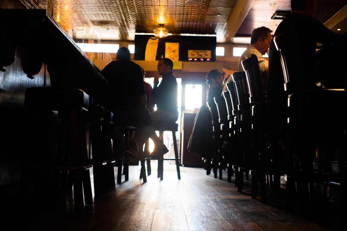 a group of people at the bar