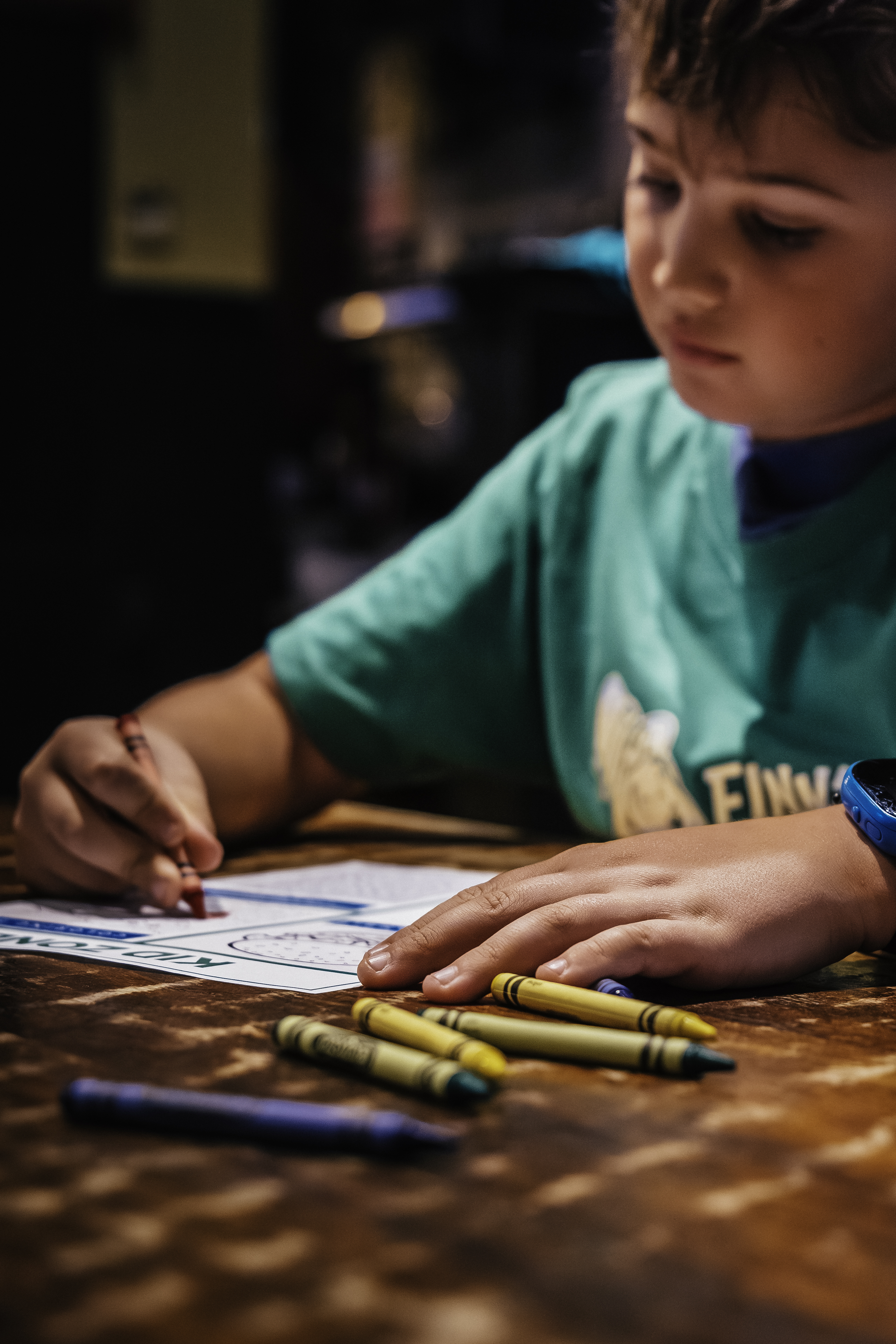 a young boy sitting on a table