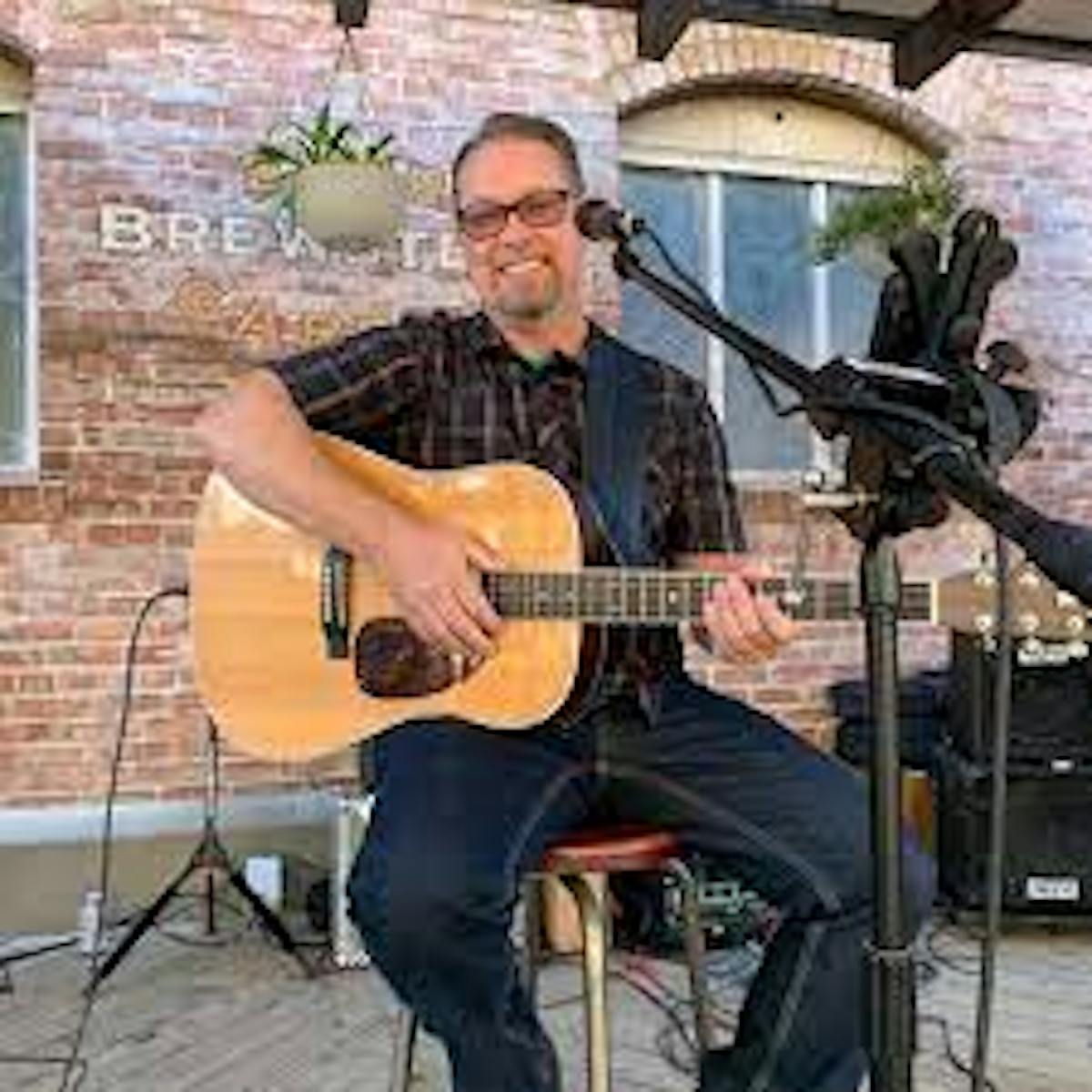 a person holding a guitar