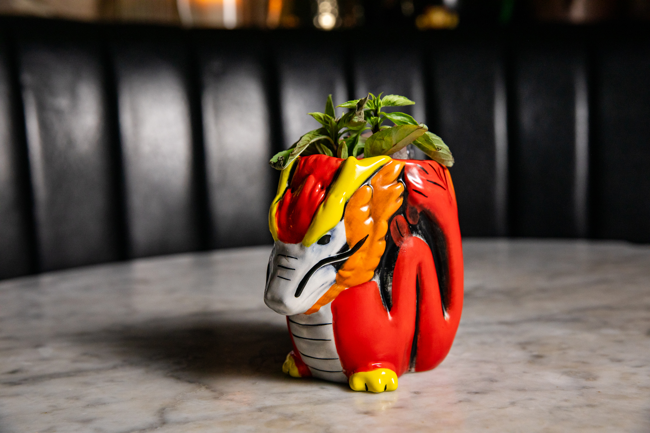 a vase of flowers sitting on top of a wooden table