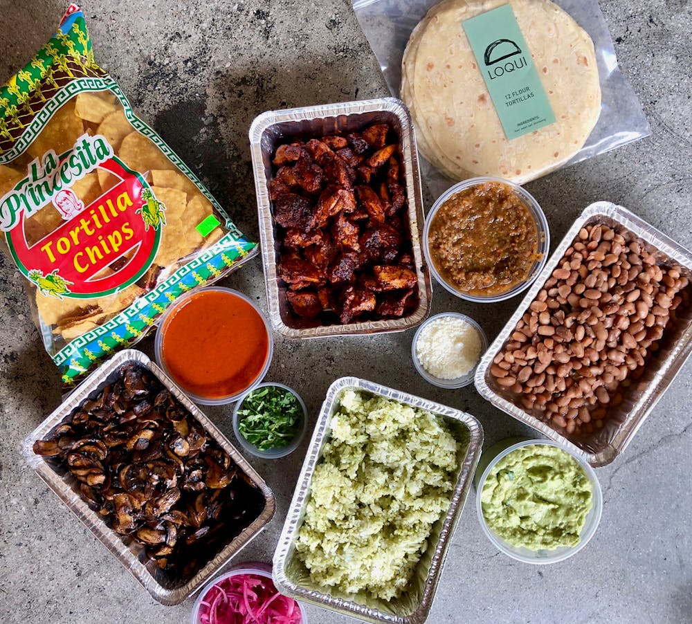 a box filled with different types of food on a table