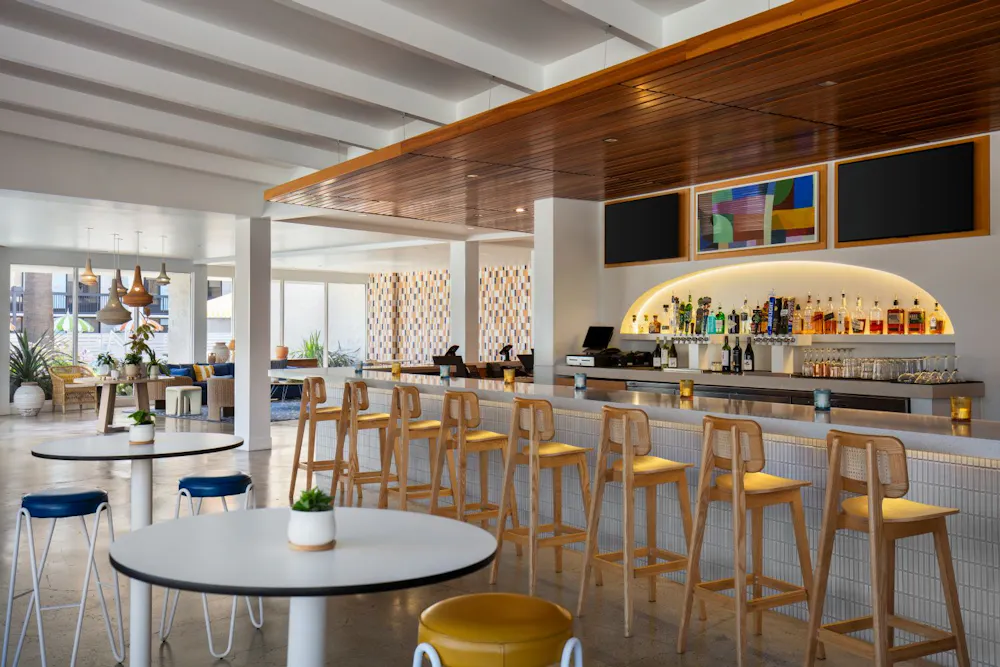 a bar with tables and chairs