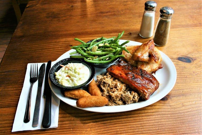 a plate of food on a wooden table