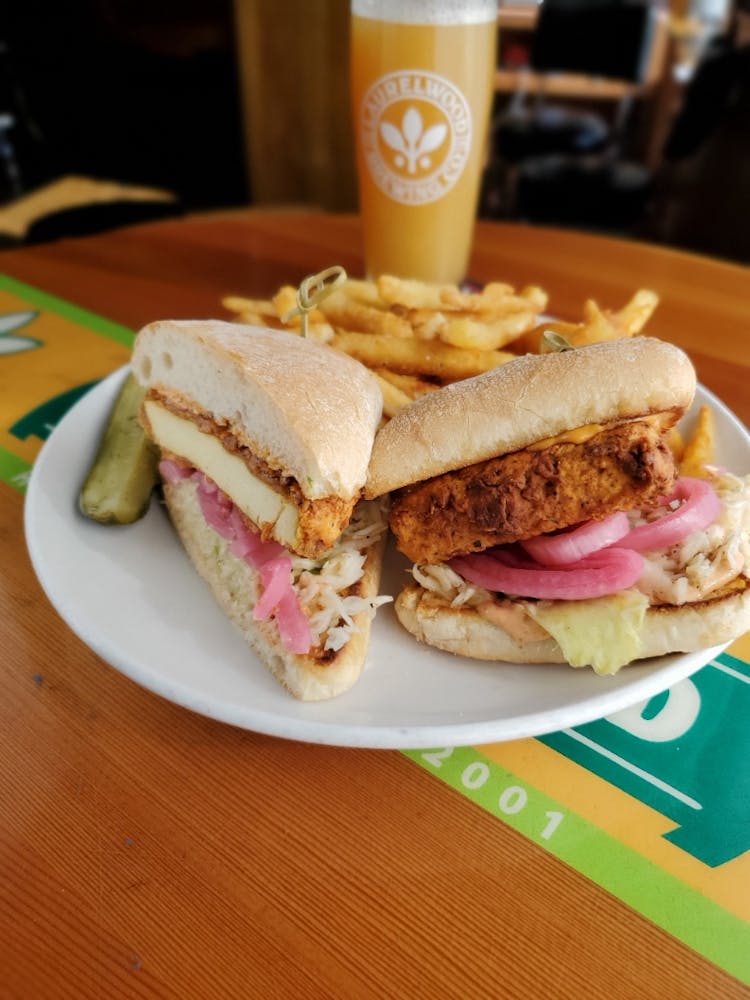 a plate with a sandwich and a cup of coffee