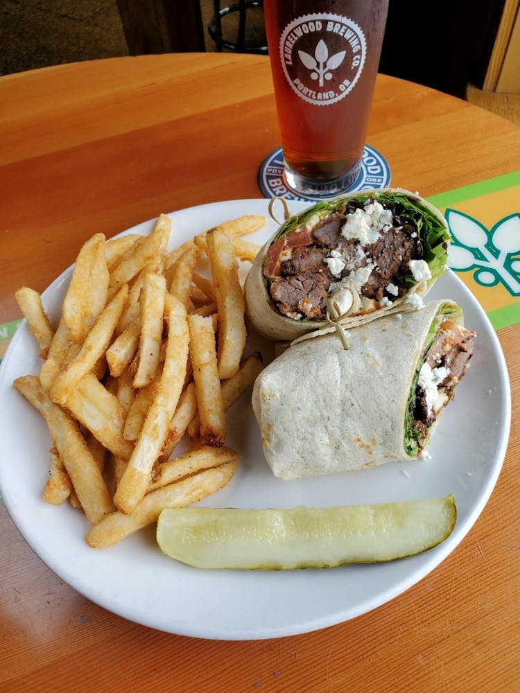 a table topped with a sandwich and fries on a plate