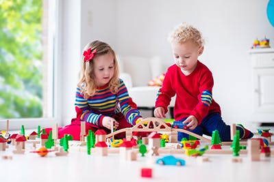 two children playing with blocks