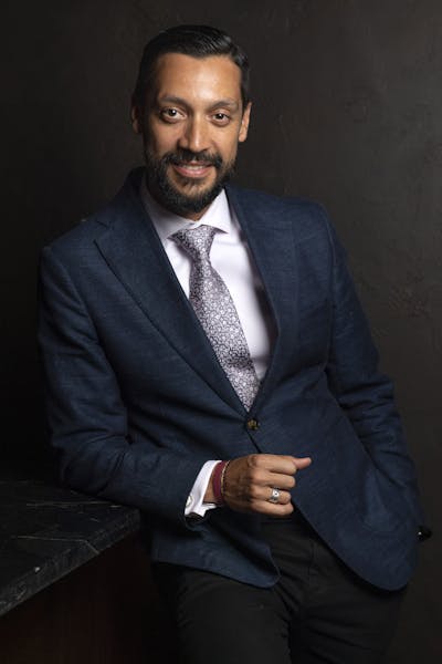 a man wearing a suit and tie