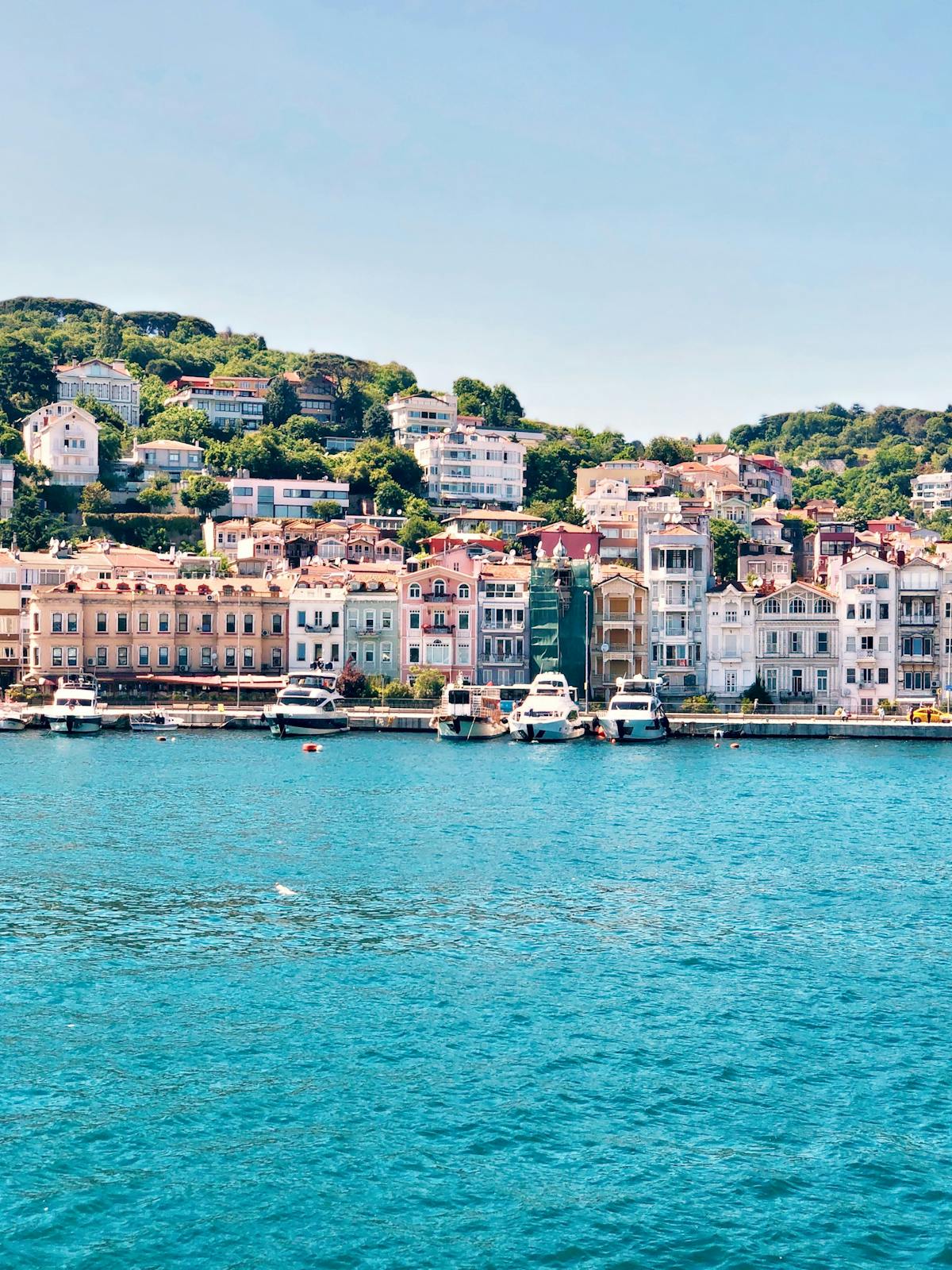 a large body of water with a city in the background