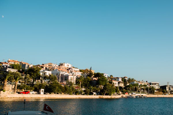 a large body of water with a city in the background