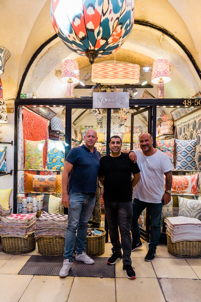 a group of people standing in front of a store