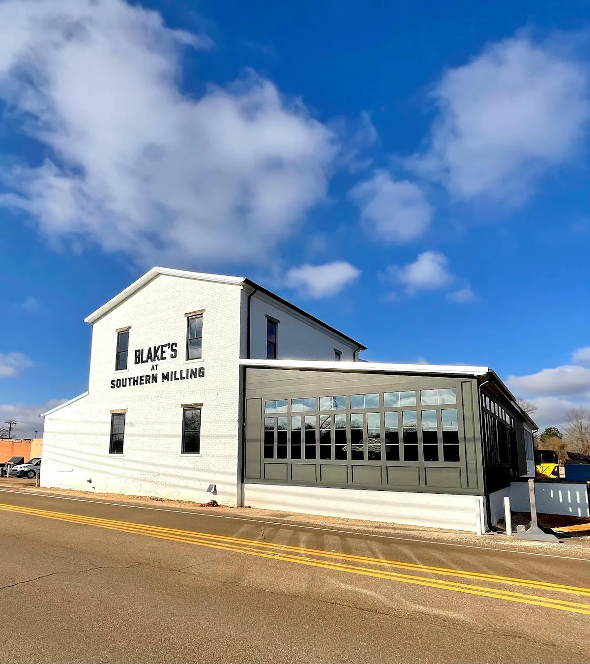 a train is parked on the side of a building