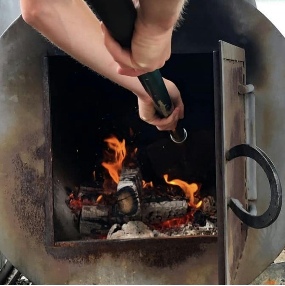 a person cooking in the oven