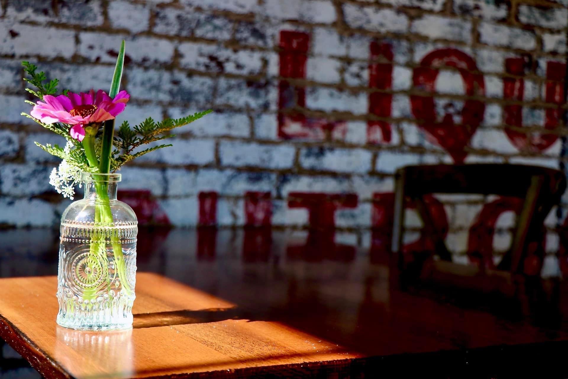 a vase of flowers sitting on a table