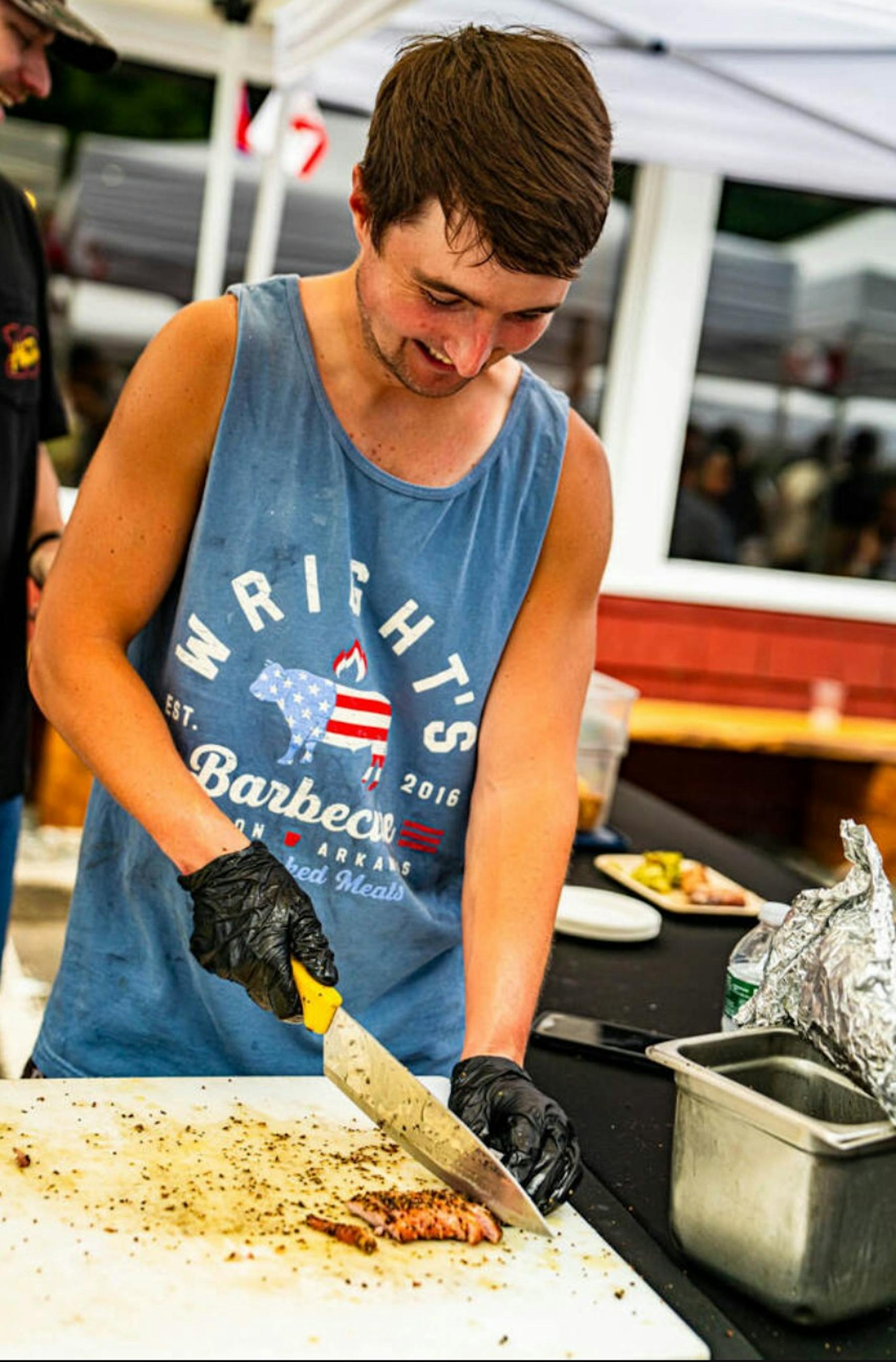a man cutting a cake