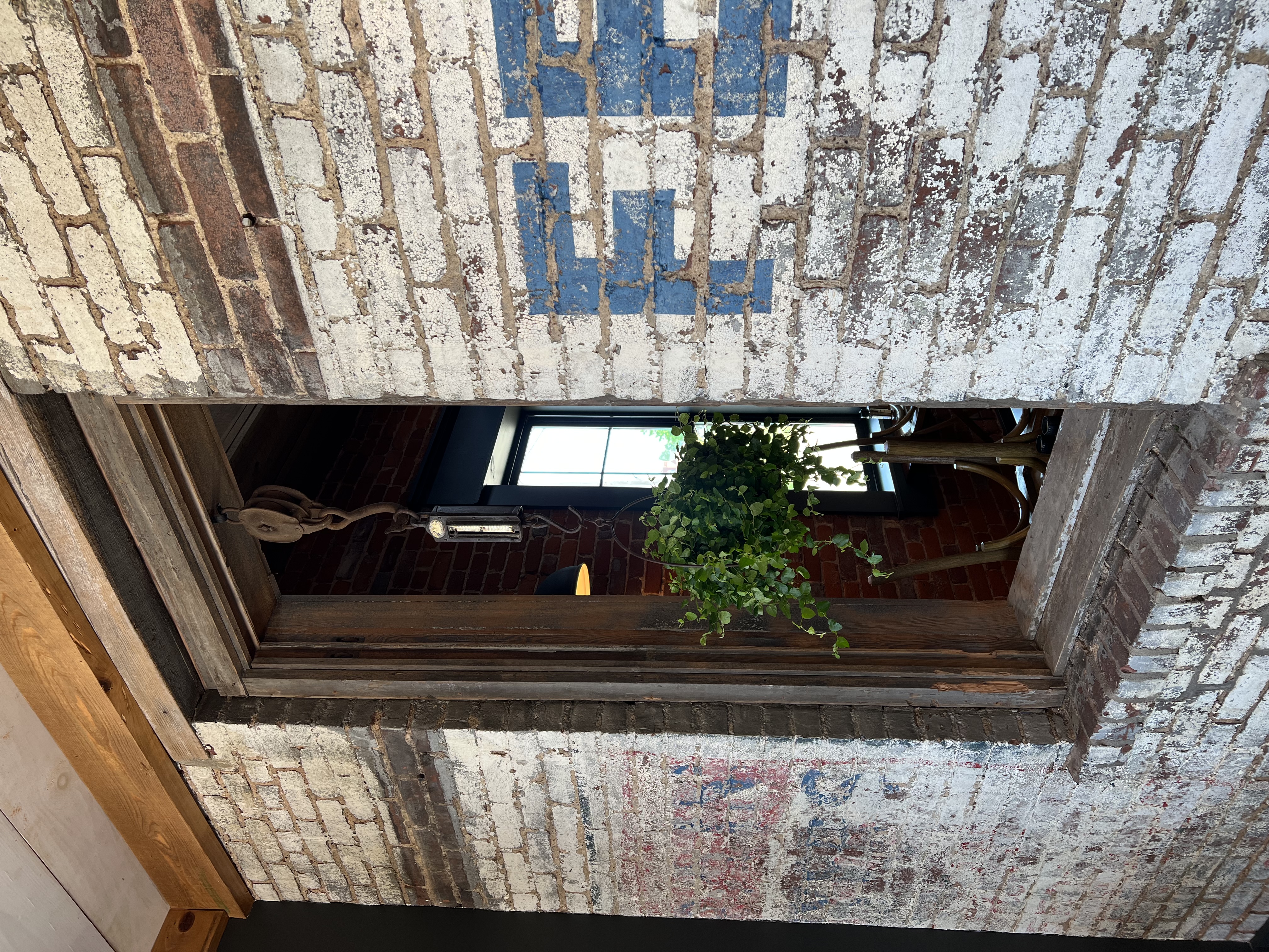 a sign in front of a brick building