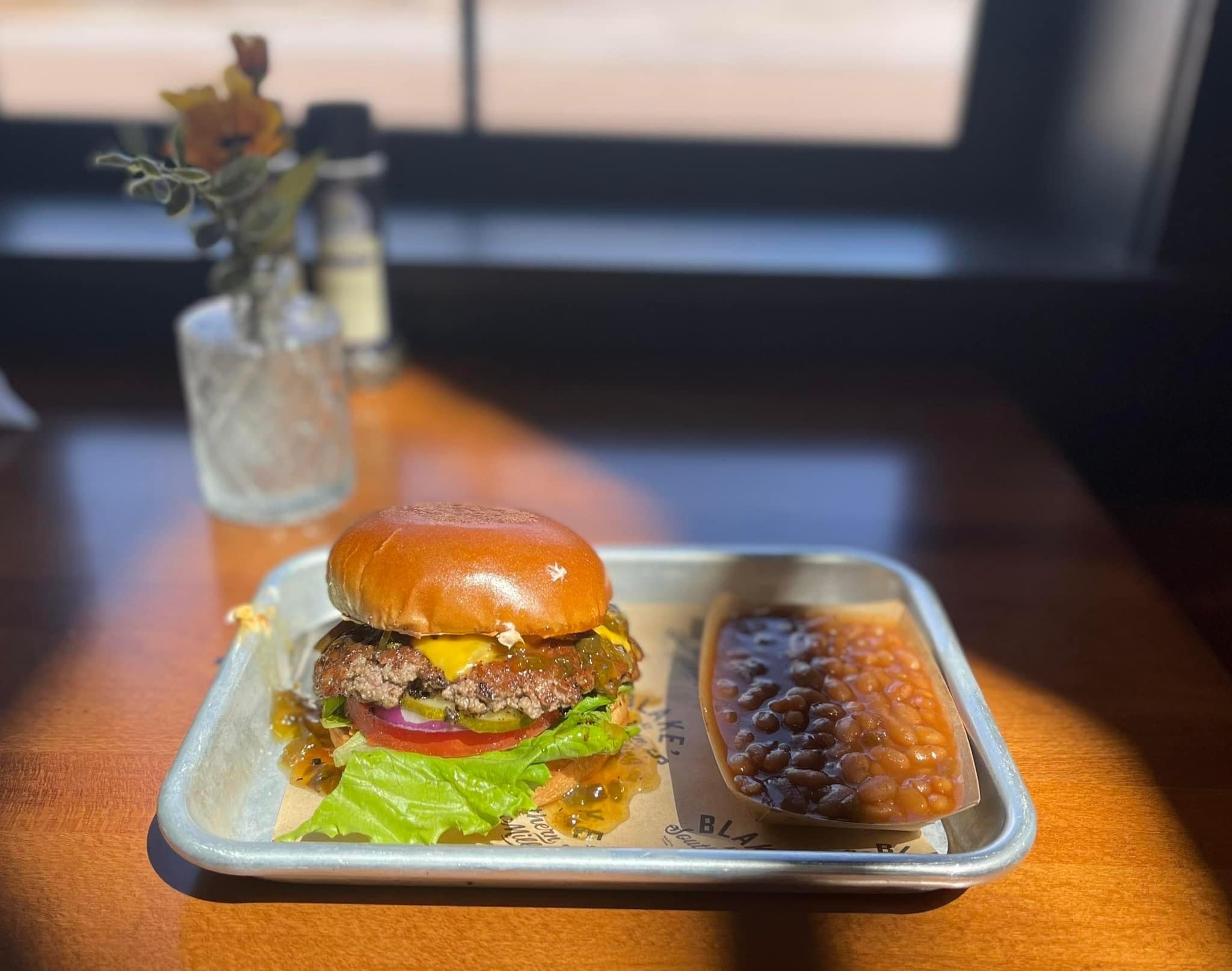 a sandwich sitting on top of a wooden table