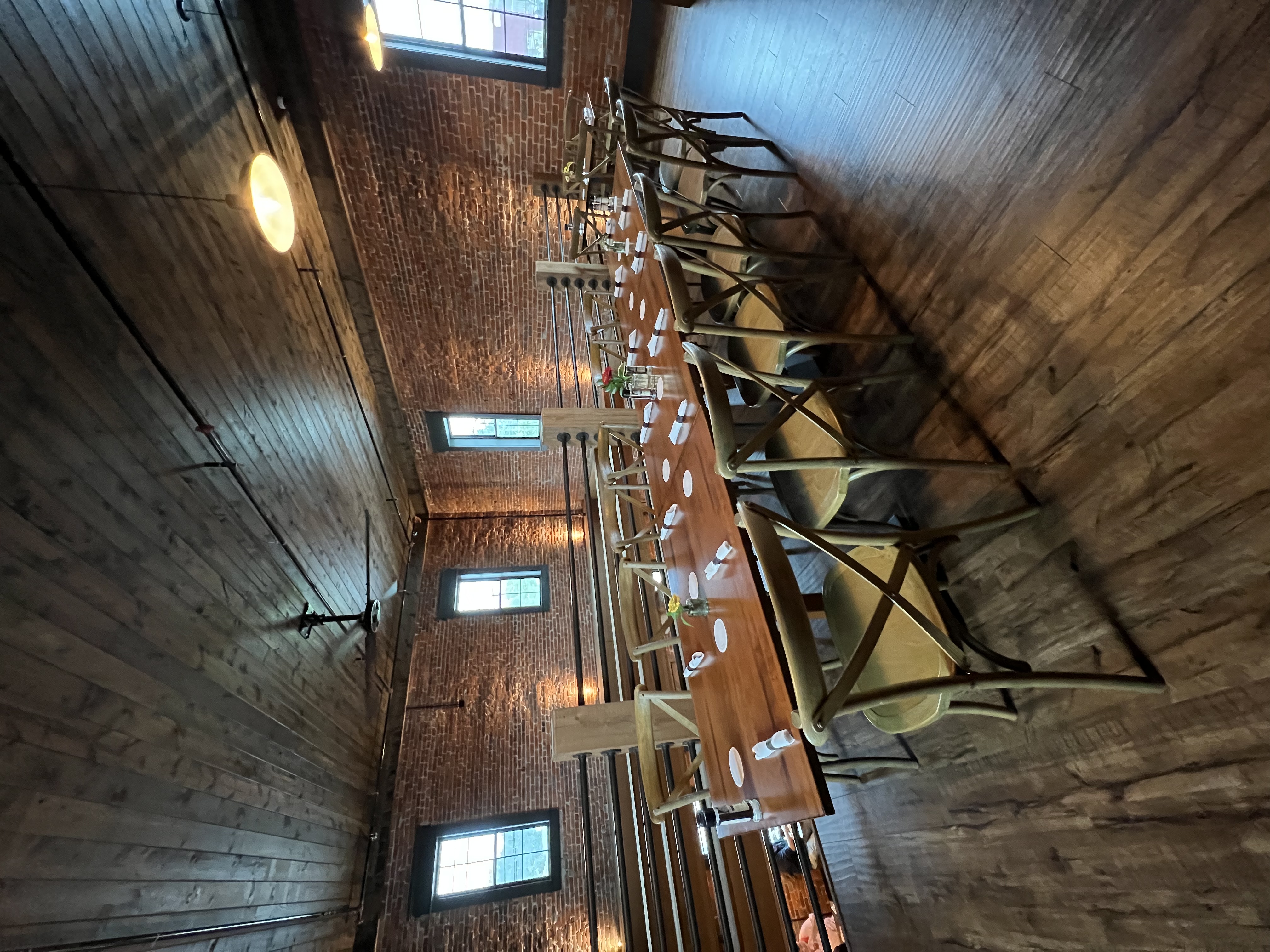 a row of wooden benches sitting on top of a table