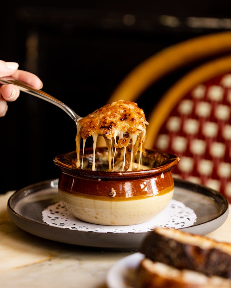 a group of people walking in front of a store