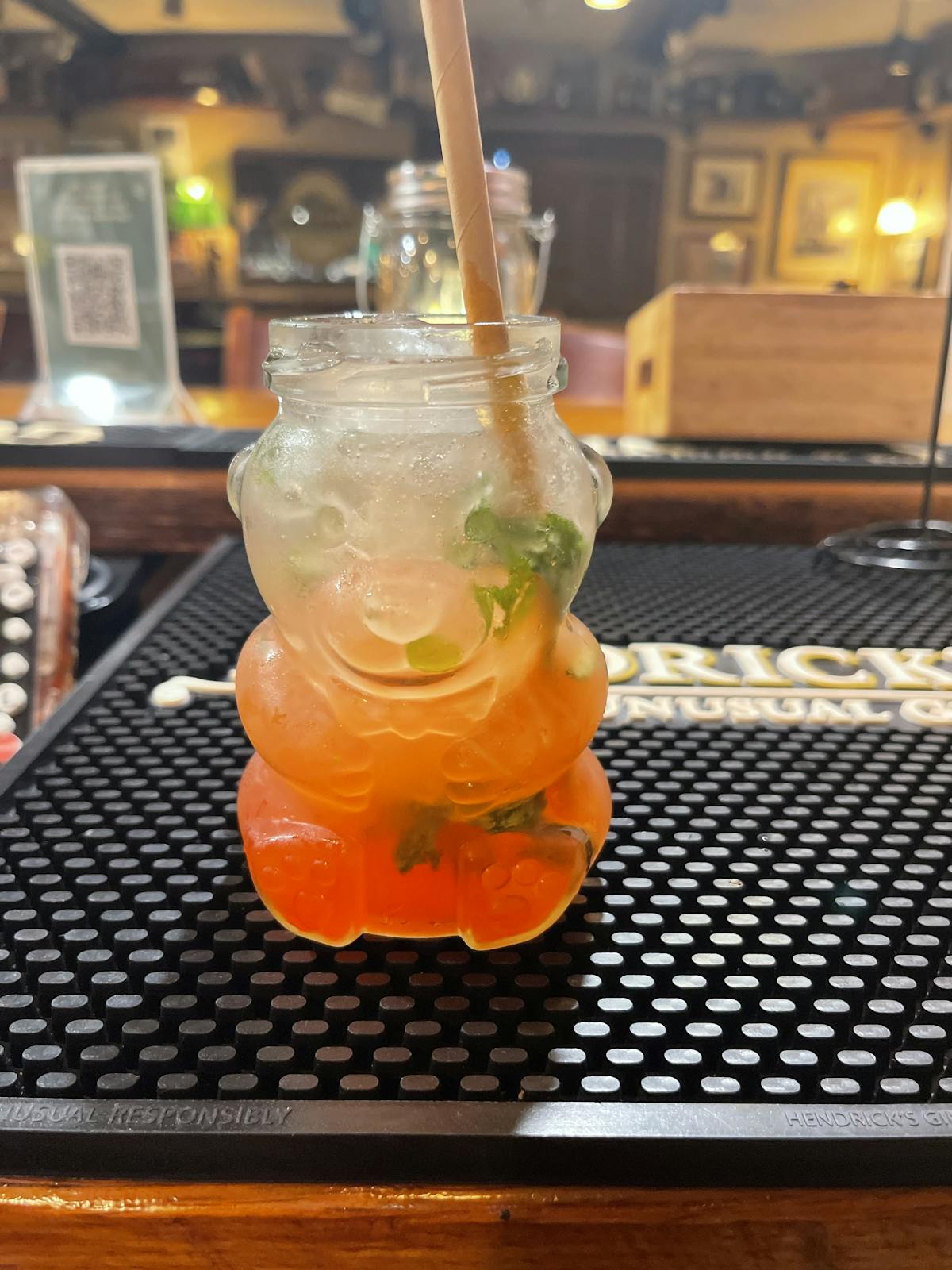 a glass of orange juice on a table