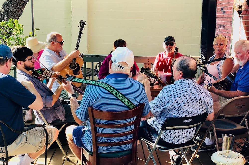a group of people sitting in a chair