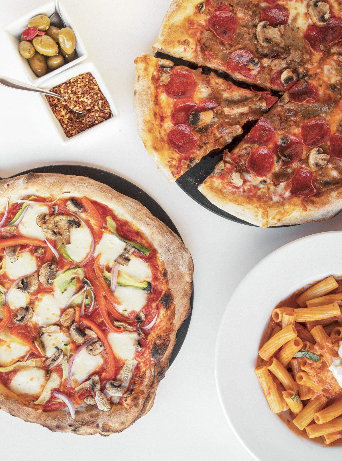 a plate of food with a slice of pizza