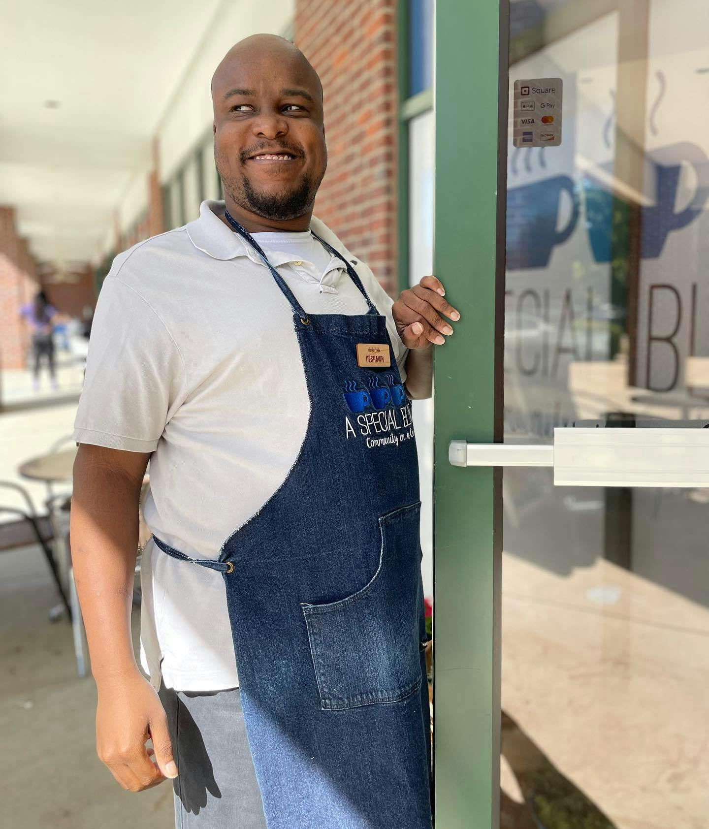 a man standing in front of a store