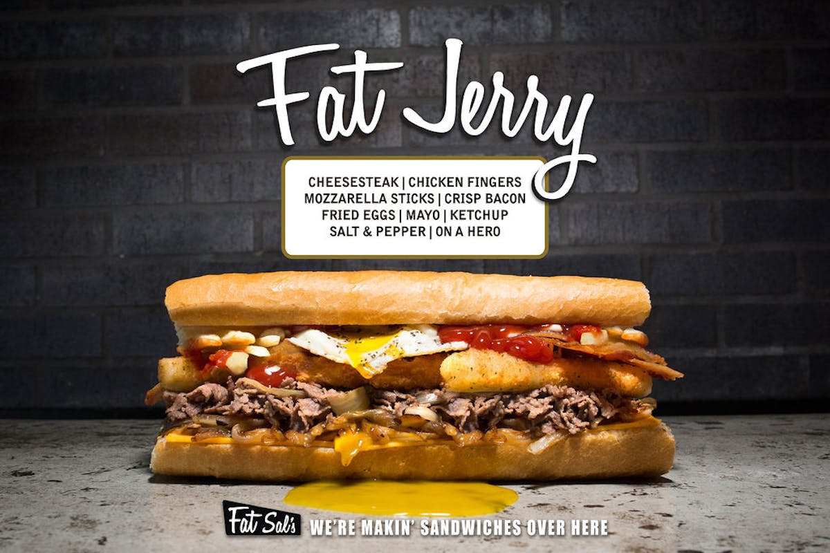 Fat Jerry sandwich from Fat Sal’s stacked with cheesesteak, chicken fingers, mozzarella sticks, bacon, fried eggs, ketchup, and mayo on a hero roll