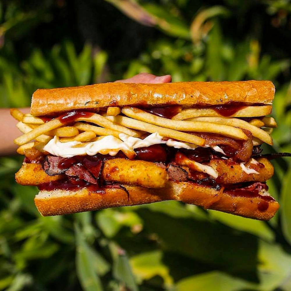 a close up of a sandwich and fries